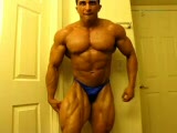 Bodybuilder Hunk poses before contest