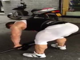Big muscle butt squats in tight lycra