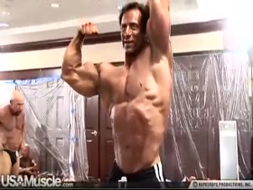 Sexy Bodybuilder Getting Ready to Get on Stage