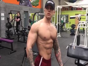 Bodybuilder Dan Walker posing in the gym