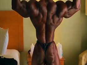 muscle man in tiny posing suit