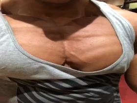 Overflowing Pecs - too big for his shirt?