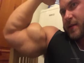 Showing off his huge arms