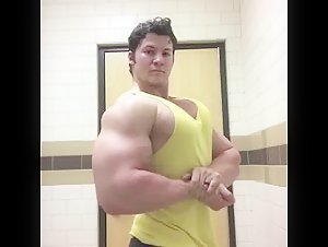 Noah flexes his huge biceps