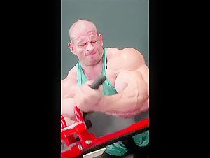 Michal krizo pumps his mega massive biceps and grunts