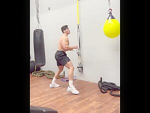 Logan Foote shows off his lean muscular body kickboxing