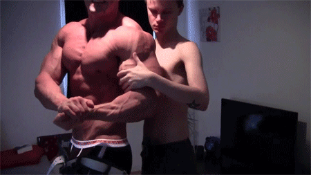 Skinny guy worships big musclehunk's huge biceps