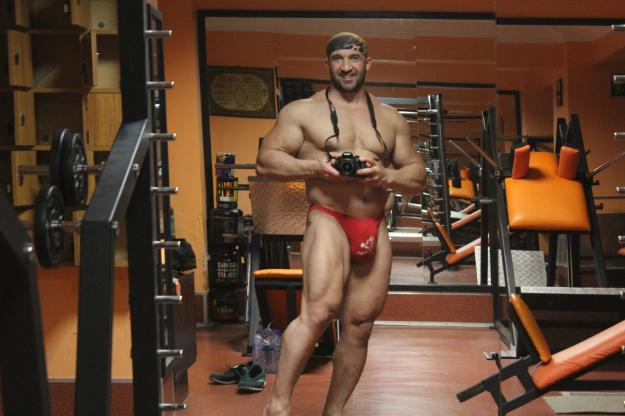 Super hung bodybuilder with extreme posers bulge