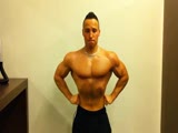 Short teen bodybuilder posing in locker