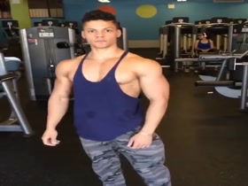 19 years young bodybuilder posing and flexing