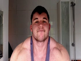 huge gay bodybuilder flexing