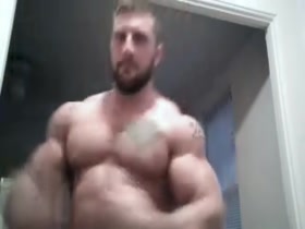 Cocky Muscle Struggles to Take Off Shirt