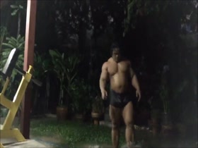 Huge Thai bodybuilder taking natural shower