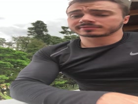 Cocky stud flexing in a compression shirt.