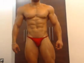 Stunning Latin Muscle Hunk - in the tiniest red posers