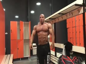 Huge Muscle God Posing in the Locker Room