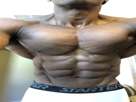 Watch him flex his shredded pecs and amazing abs.