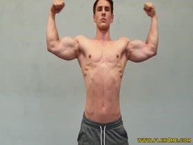 Young hotties pumps up his huge biceps