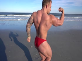 Jake flexing and posing at the beach