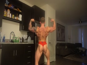 bodybuilder posing in red briefs