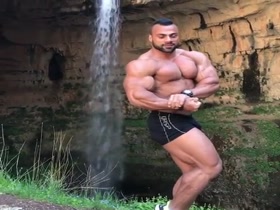 Huge Muscles Posing in the Outdoors
