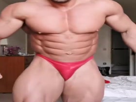 Huge Muscle God.  Tiny Red Posers