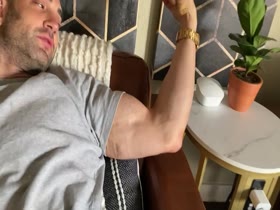 Hot guy flexes biceps