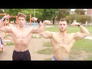 2 biceps GODS posing outdoors