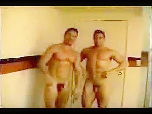 Muscular men in the shower
