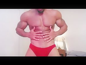 Hunk flexes muscles and masturbates