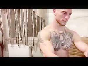 Tattooed Bodybuilder Posing Naked