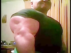 Massive Biceps in tight T-Shirt