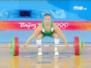 Muscled weightlifter in pain after failing at the Olympics