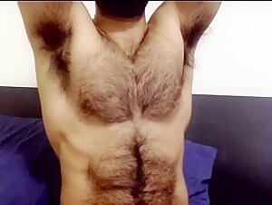 Hairy hunk showing off pits