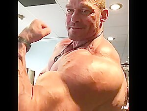 Massive Bodybuilder Jørgen Corneliussen flexing…