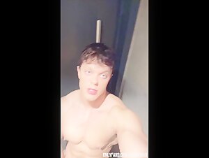 Young bodybuilder in the gym bathroom
