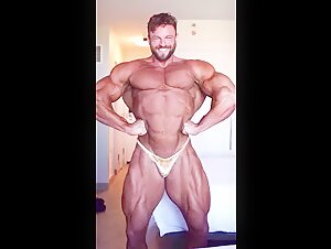 Eric Janicki flexing in gold posers