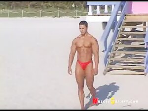 Bodybuilder wearing thong on the beach