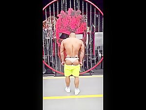 bodybuilder takes off his shorts